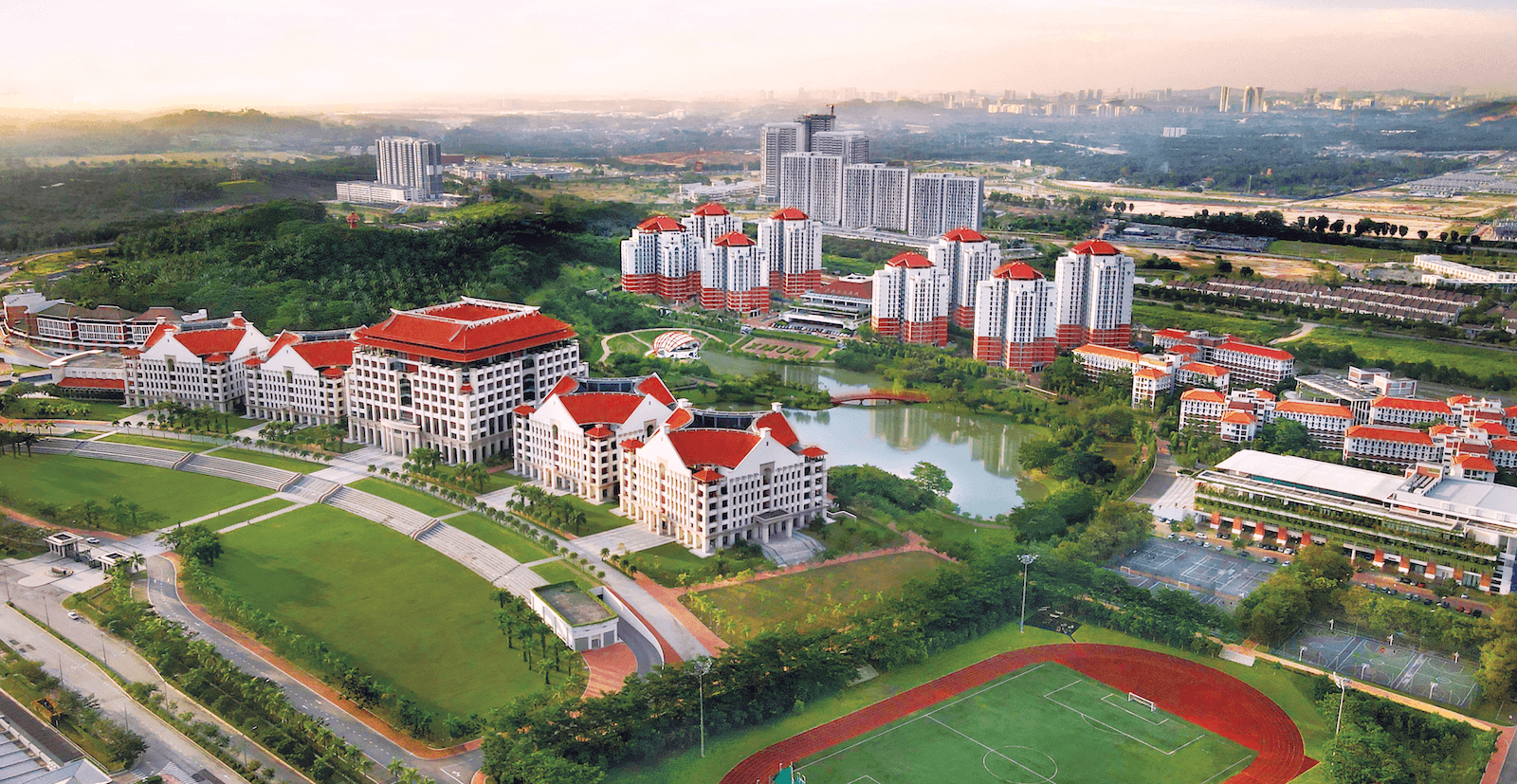 Red-roofed buildings and the lake at Xiamen University Malaysia